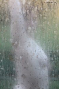windowwm Naked woman through dirty window