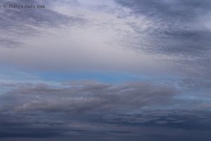 dark clouds against a blue sky
