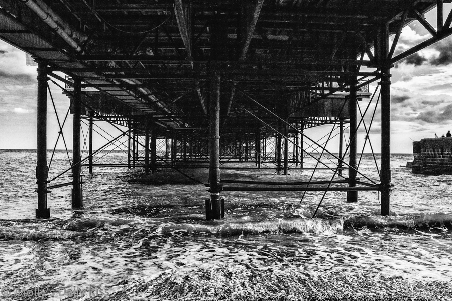 Under the pier Brighton in black and white
