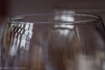 Self portrait reflection in wine glass