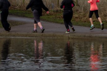 Runner feet reflected in pond St Albans