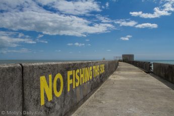 No Fishing words on Brighton breakwater wall Brighton Marina
