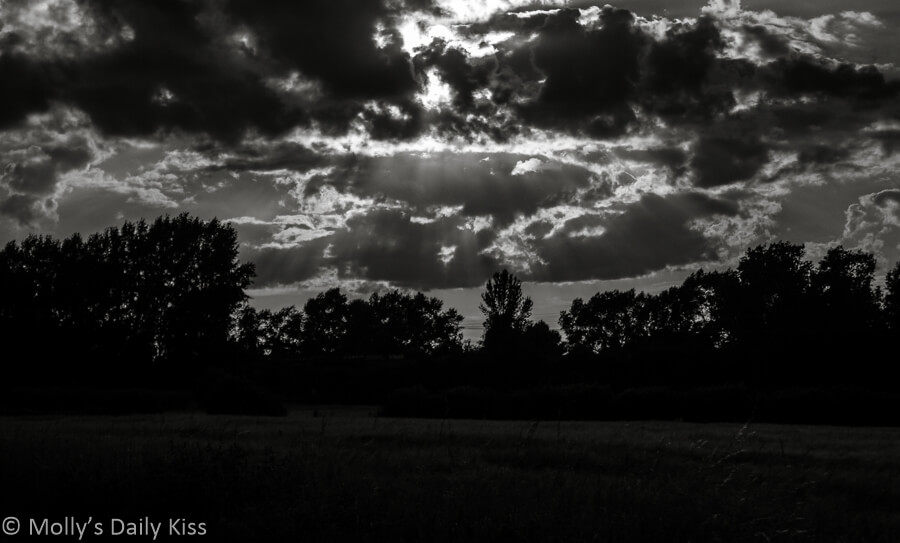 Clouds with sun shining through black and white, sweetest summer