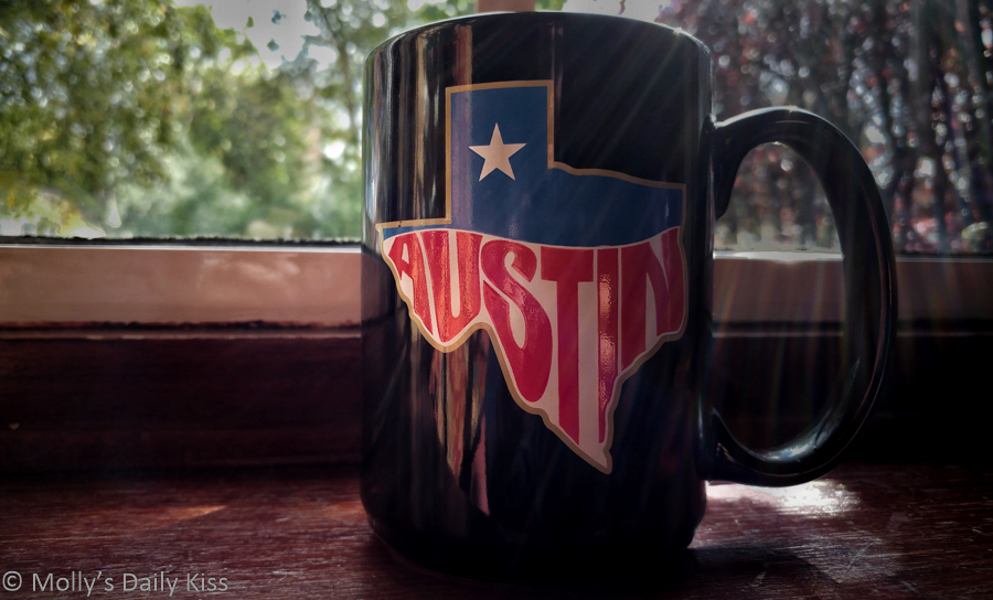 Black Austin tea mug in the sun