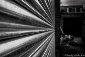 Metal garage door in black and white