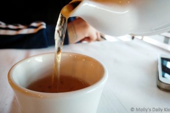 Pouring jasmine tea into teacup