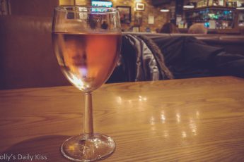 Glass of Rosa wine on table in pub