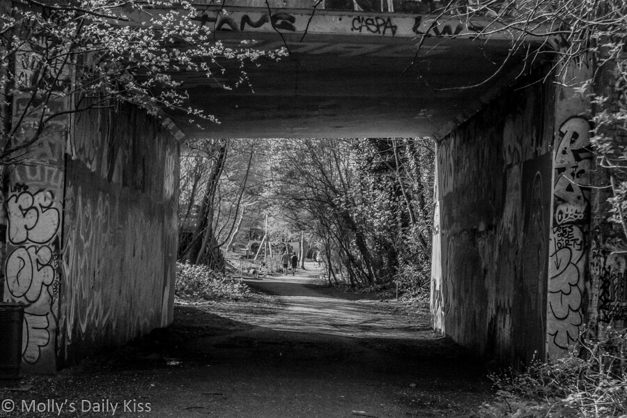 Tunnel on path footpath through London in black and white