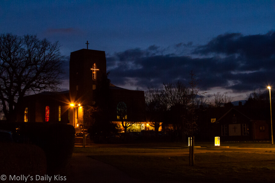 Our Lady's Church Woodhall Welwyn Garden City lit up in the darkness of the night