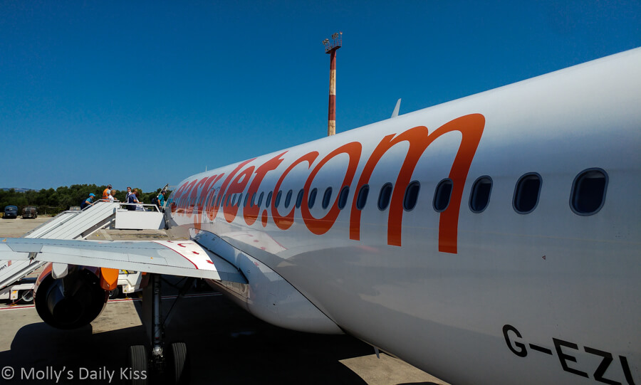Easy Jet plane on the runway at Kefalonia airport with holiday blue skies
