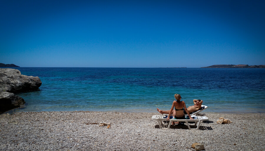 Two people on the beach in Kefalonia Greece