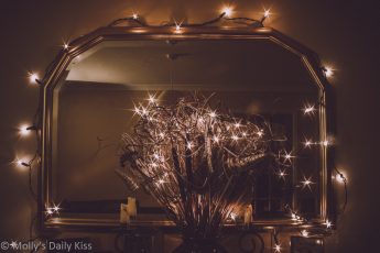 Christmas fairy lights around mirror