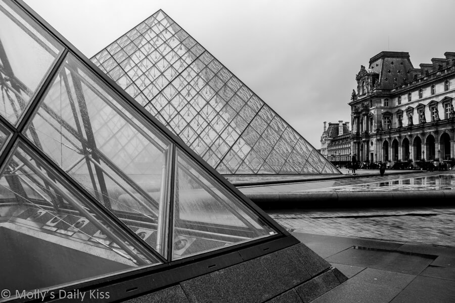 Black and white of the Louvre glass pyramid in the rain