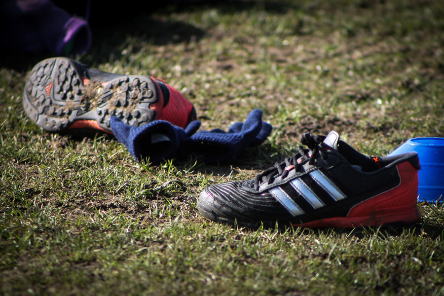 discarded football boots and gloves