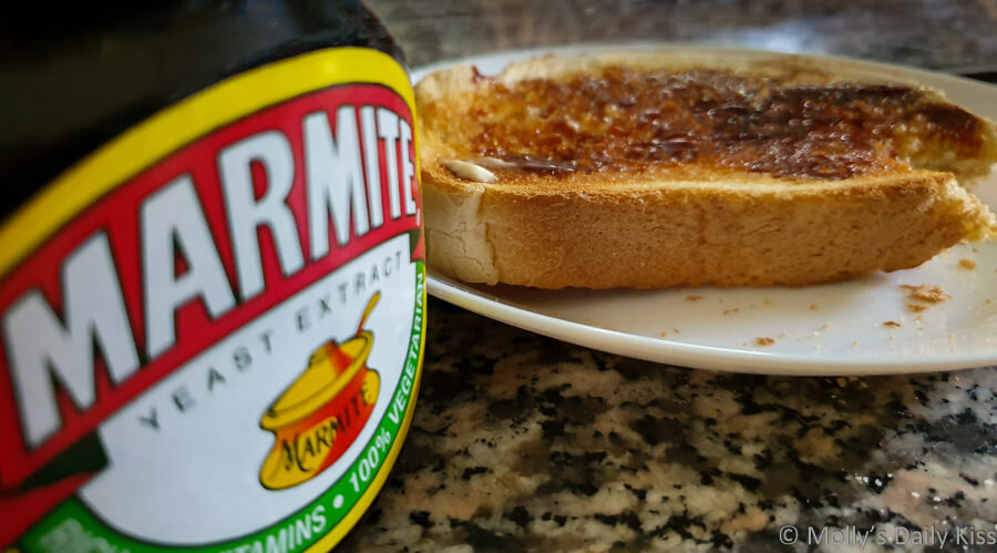 jar of marmite and toast with marmite on it