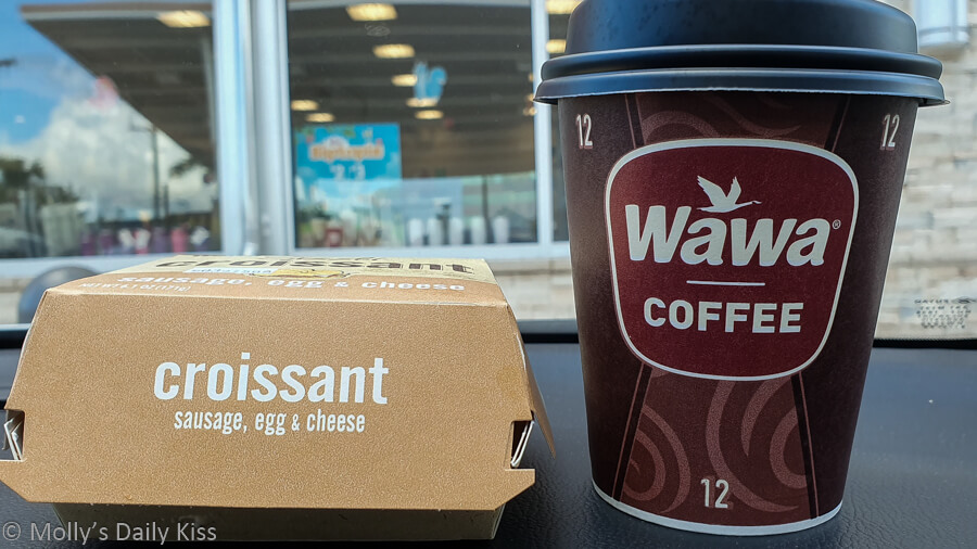 Wawa breakfast on dashboard of car