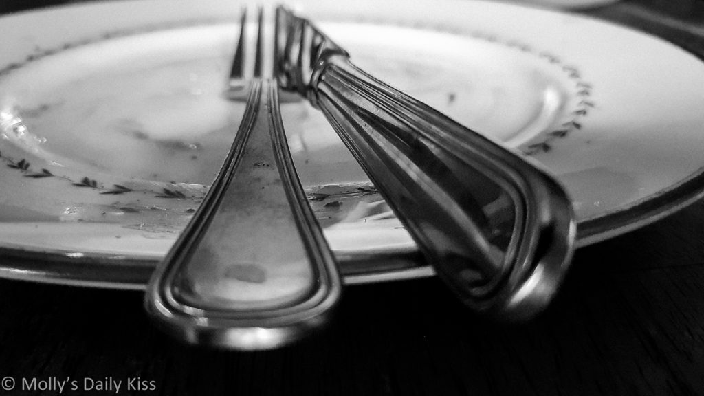 Knife and fork on empty plate