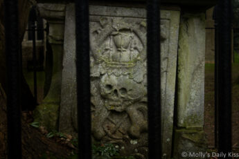 Skull and crossbones on tombstone of the dead