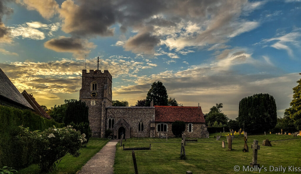 Graveley church Hertfordshite with sunsetting behind it