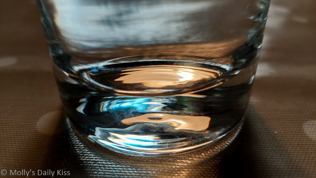 light reflected in the base of a glass