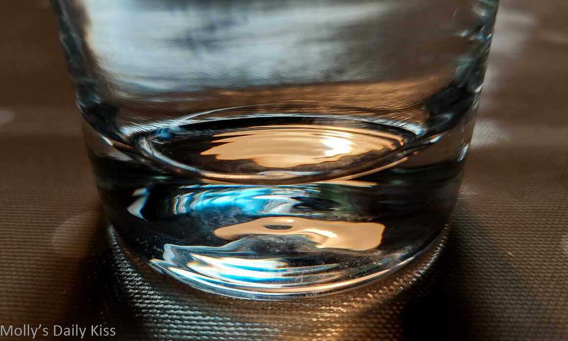light reflected in the base of a glass