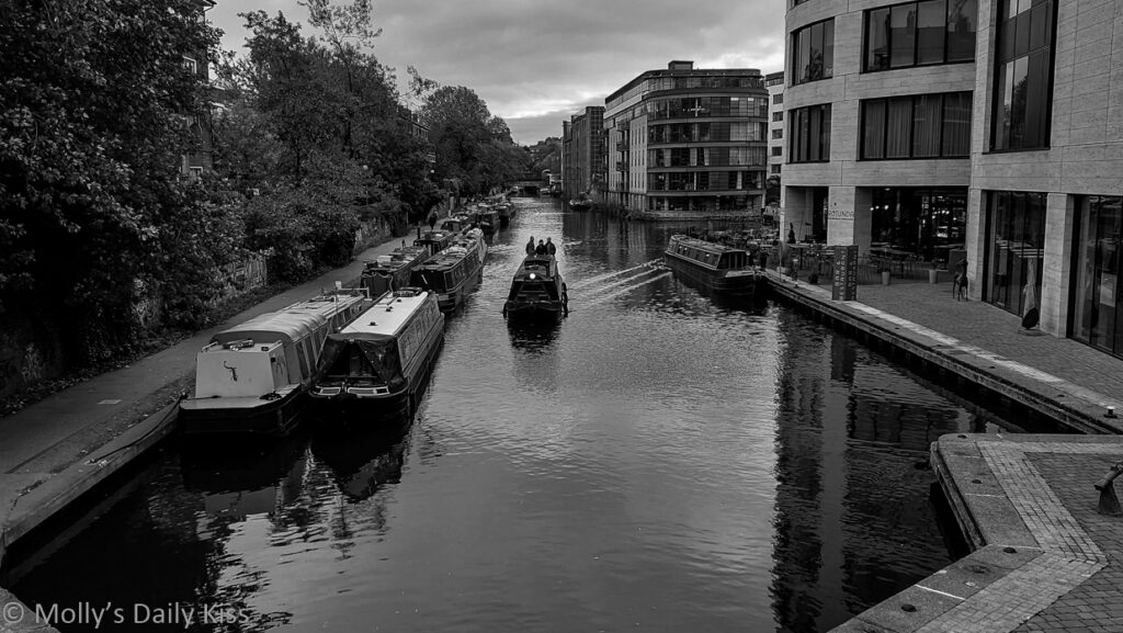 Boat moving down Regents canal at Kings Cross