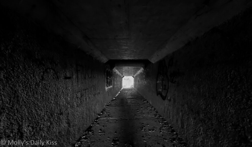 looking through subway to light beyond is a local walking route