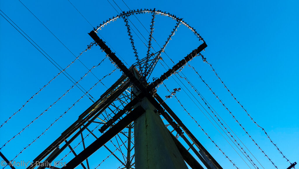 Electrcity wires against the blue sky is man's invention