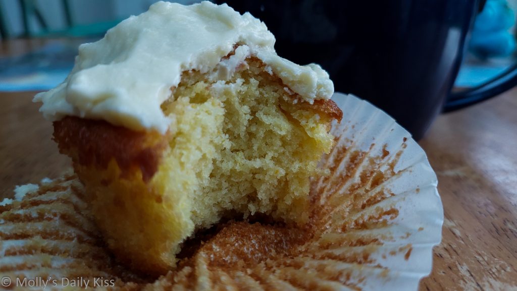 Have some cake - lemon muffin with bite taken from it