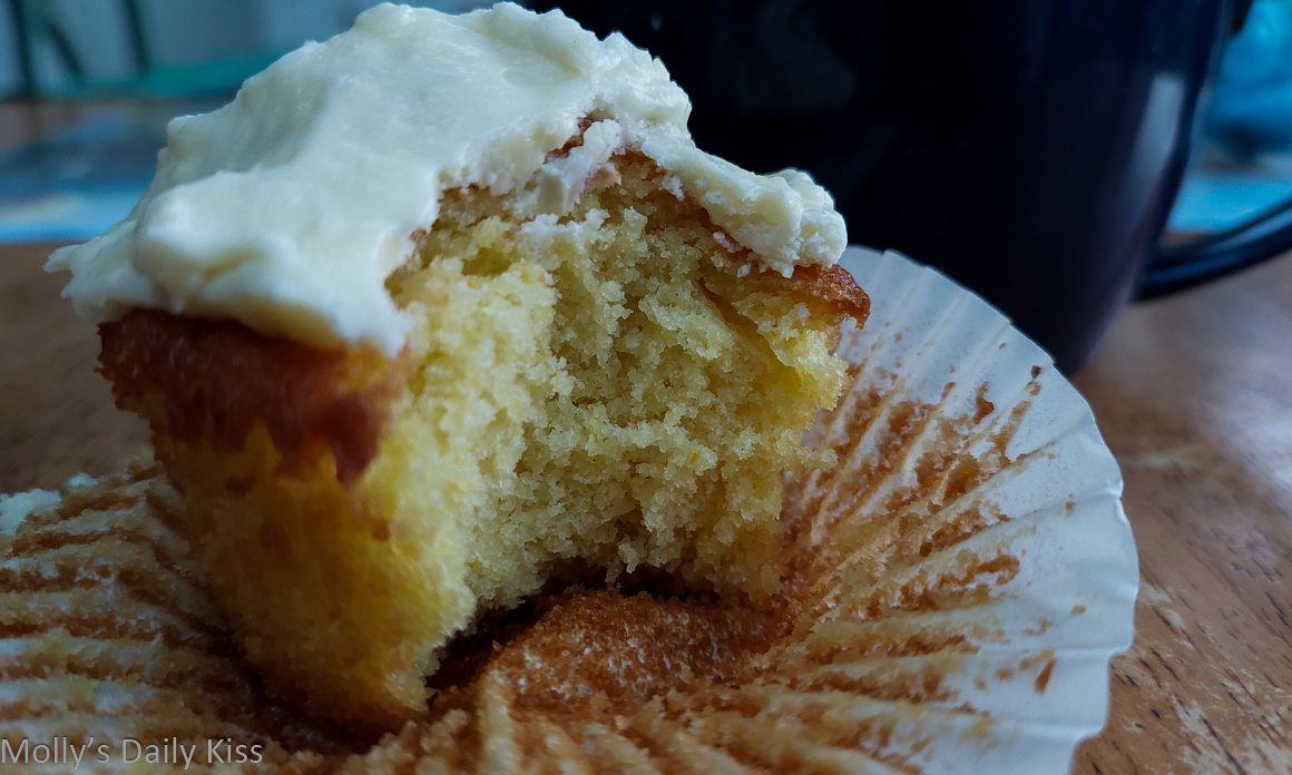 Have some cake - lemon muffin with bite taken from it