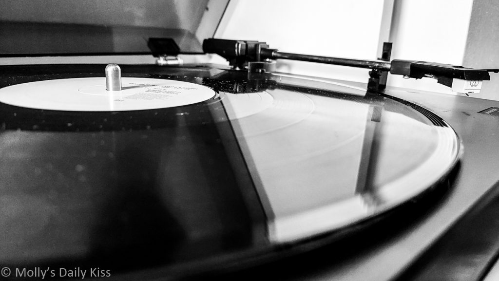 Black and white of vinyl record on record player